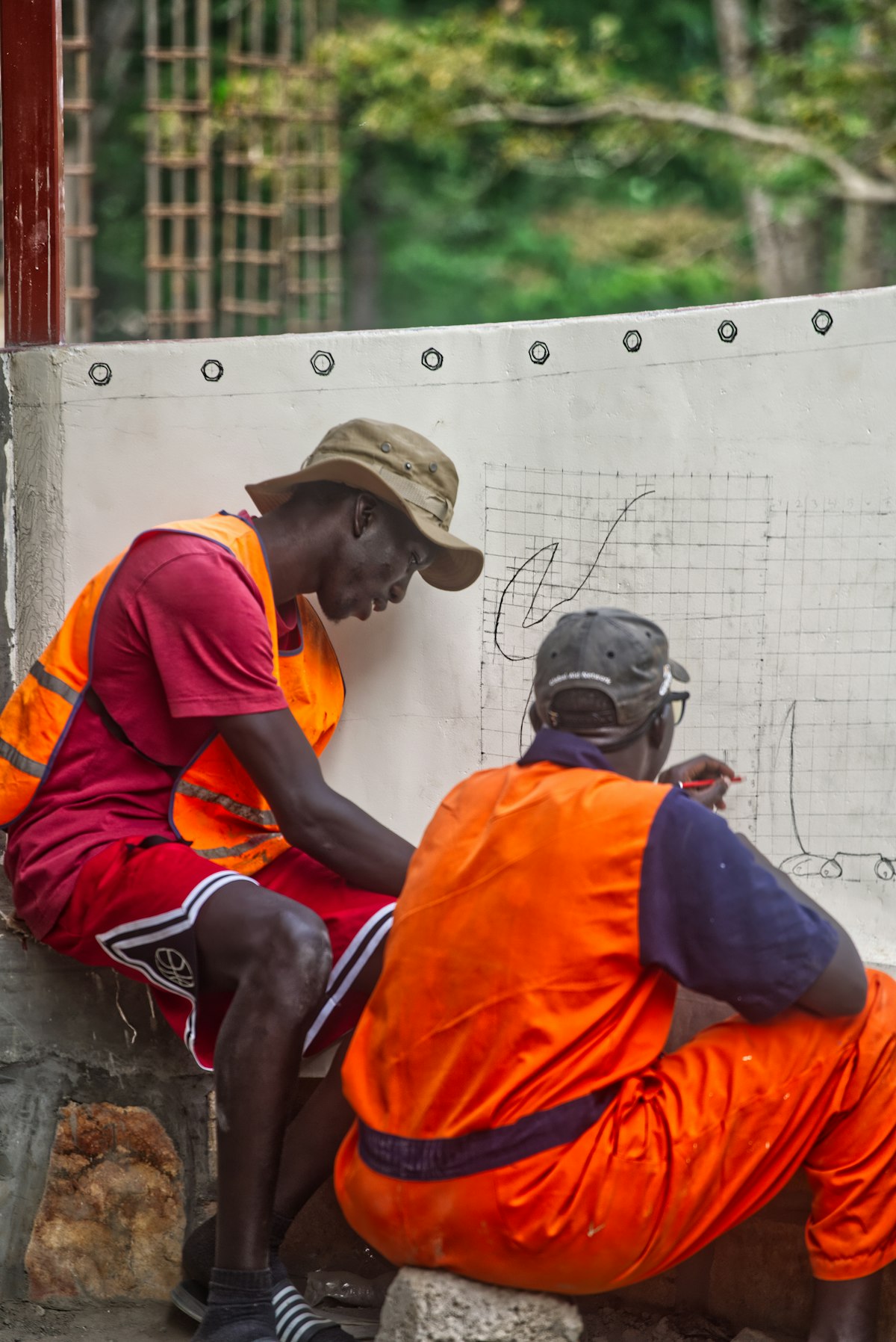 A landscaping crew working through project details on site